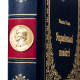 Подарункове видання  "Українські повісті" М. В. Гоголь з металевим посрібленим барельєфом письменника і позолоченою реплікою монети