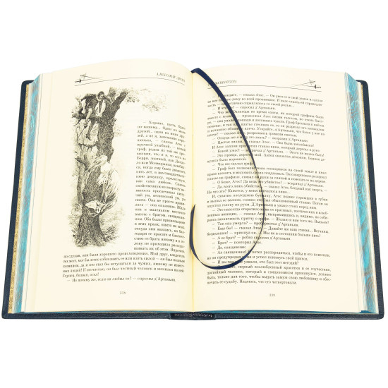 Подарункове видання «Три мушкетери» О. Дюма з декором посрібленими металевими репліками монет з портретами мушкетерів з емалями